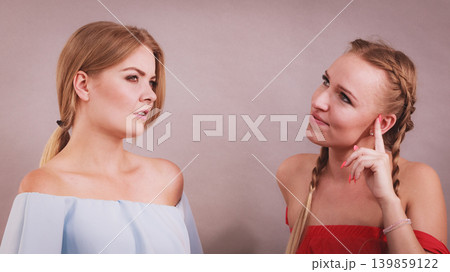 Two women talking together Two women talking together 139859122
