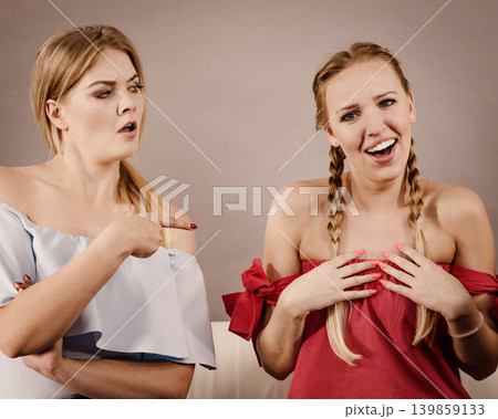 Women accusing each other of something Women accusing each other of something 139859133
