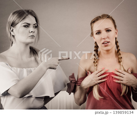 Women accusing each other of something Women accusing each other of something 139859134