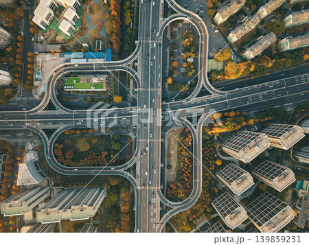 An aerial scene capturing traffic movement on a complex elevated highway and its connecting ramps in China during autumn season An aerial scene capturing traffic movement on a complex elevated highway and its connecting ramps in China during autumn season 139859231