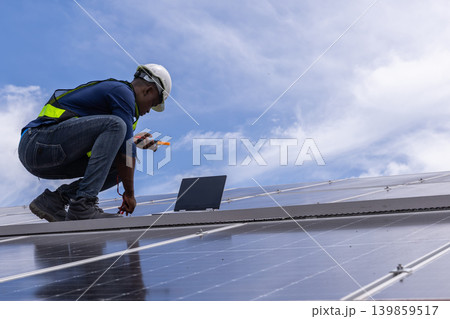 Engineer service check installation solar cell on the roof of factory. 139859517