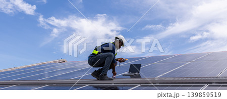 Engineer service check installation solar cell on the roof of factory. Engineer service check installation solar cell on the roof of factory. 139859519