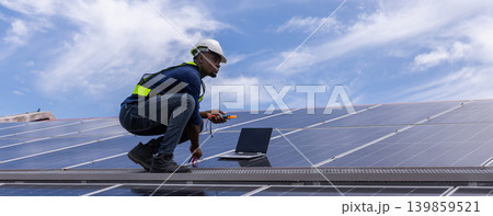 Engineer service check installation solar cell on the roof of factory. Engineer service check installation solar cell on the roof of factory. 139859521