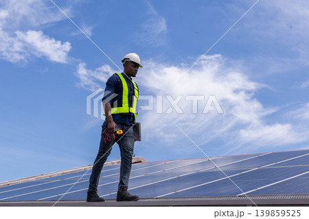 Engineer service check installation solar cell on the roof of factory. Engineer service check installation solar cell on the roof of factory. 139859525