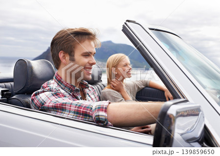 Couple, convertible and driving on mountain road in nature for bonding adventure for holiday, journey or travel. Man, woman and car in California for vacation destination or connection, trip or view Couple, convertible and driving on mountain road in nature for bonding adventure for holiday, journey or travel. Man, woman and car in California for vacation destination or connection, trip or view 139859650