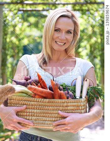 Woman, portrait and basket of vegetables or farming harvest for small business, production or sustainability. Female person, face and carrots or beetroot with leafy greens for career, organic or diet Woman, portrait and basket of vegetables or farming harvest for small business, production or sustainability. Female person, face and carrots or beetroot with leafy greens for career, organic or diet 139859674