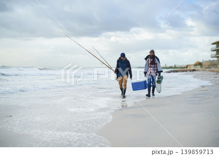 Water, fishing and men walking on beach together with cooler, tackle box and holiday conversation. Ocean, fisherman and friends with rods, bait and tools at waves on winter morning vacation at sea. 139859713