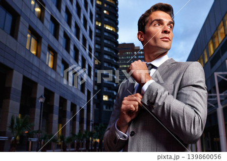 Travel, night and business man thinking in a city street for dream, vision or job opportunity. Idea, planning and male entrepreneur in New York road for evening trip, immigration or startup goal Travel, night and business man thinking in a city street for dream, vision or job opportunity. Idea, planning and male entrepreneur in New York road for evening trip, immigration or startup goal 139860056
