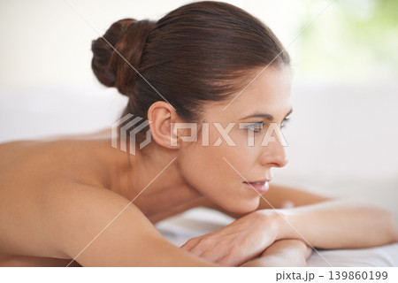 Luxury, spa and woman relax on table for skin care or treatment for beauty in hotel on holiday or vacation. Calm, person and girl on bed in salon or resort with wellness and healthy stress relief 139860199