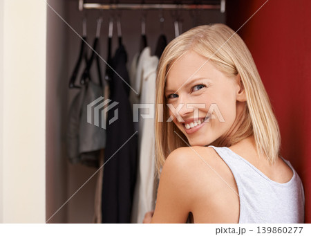 Woman, portrait and wardrobe with fashion, choice and idea for outfit with smile, happy and variety. Designer, closet and thinking with clothes, dress and decision with confidence and selection Woman, portrait and wardrobe with fashion, choice and idea for outfit with smile, happy and variety. Designer, closet and thinking with clothes, dress and decision with confidence and selection 139860277