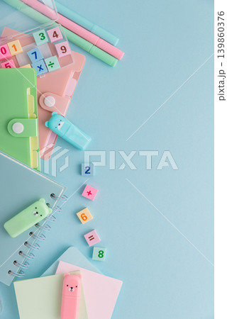 Pastel school supplies flat lay on light blue background 139860376