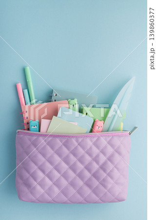 Pastel school supplies filling a quilted pencil case Pastel school supplies filling a quilted pencil case 139860377