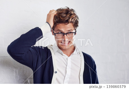 Business, stress and frustrated man with hands in hair for crisis, disaster or panic on wall background. Doubt, overthinking and male entrepreneur with startup risk, fail or bankruptcy and anxiety 139860379