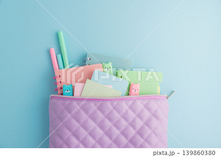 Pastel school supplies filling a quilted pencil case Pastel school supplies filling a quilted pencil case 139860380