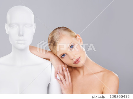 Woman, face and beauty, relax on mannequin and unique for skincare, wellness and glow on white background. Portrait, natural cosmetics and dermatology with individuality, robot or dummy in studio Woman, face and beauty, relax on mannequin and unique for skincare, wellness and glow on white background. Portrait, natural cosmetics and dermatology with individuality, robot or dummy in studio 139860453