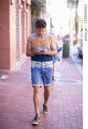 Man, phone and social media in city or communication, texting and browsing on internet or online. Male person, urban town and walking on street, website and mobile app for conversation on tech Man, phone and social media in city or communication, texting and browsing on internet or online. Male person, urban town and walking on street, website and mobile app for conversation on tech 139860463