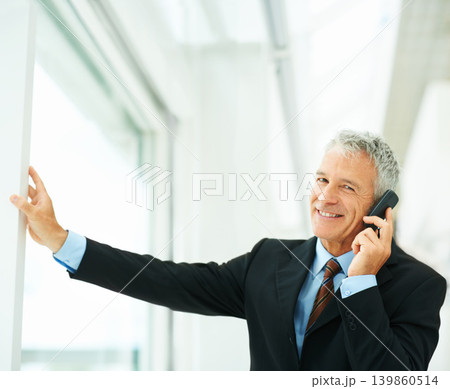 Mature employee, smile and phone call in office building talking to boss of corporate company for business. Executive, chat and happy for job in workplace, technology and connect for communication Mature employee, smile and phone call in office building talking to boss of corporate company for business. Executive, chat and happy for job in workplace, technology and connect for communication 139860514