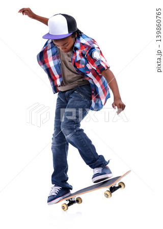 Skateboard, trick or African kid in studio with trendy fashion, skill or talent with jump or cool style. Skater, performance or young male child skateboarding with energy isolated on white background 139860765