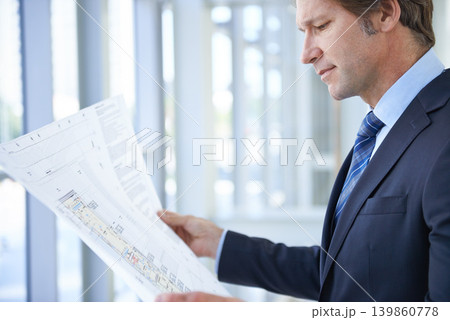 Engineering blueprint, architecture and man in office with papers for planning, building project and property. Real estate, contractor and person with document, idea or drawing for floor plan 139860778