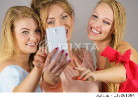 Fashionable women taking selfie 139861094