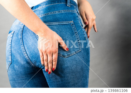 Woman hips buttocks in jeans clothing 139861106