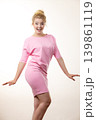 Woman wearing pink elegant dress 139861119