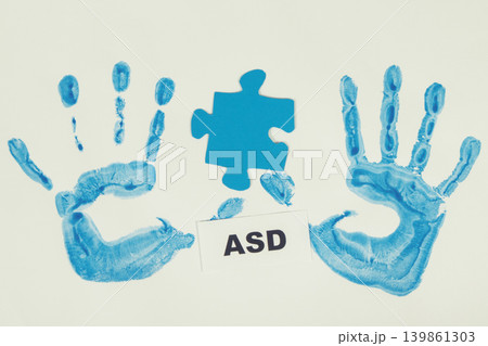 Kid handprint made of paint and inscription ASD. Autism Spectrum Disorder Kid handprint made of paint and inscription ASD. Autism Spectrum Disorder 139861303