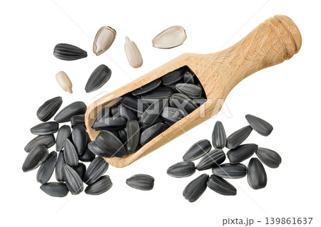 Sunflower seeds in wooden scoop isolated on white background. Top view. Flat lay Sunflower seeds in wooden scoop isolated on white background. Top view. Flat lay 139861637