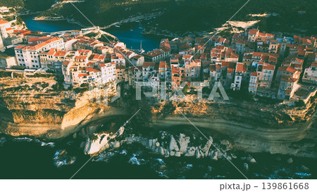 An ancient city with dense buildings on a cliff above the sea surf An ancient city with dense buildings on a cliff above the sea surf 139861668