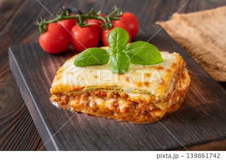 Traditional Lasagna Bolognese Slice Served On Dark Rustic Wooden Board Traditional Lasagna Bolognese Slice Served On Dark Rustic Wooden Board 139861742