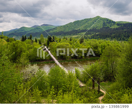 Spring picturesque river band view. Mountains scenery view behind (Stryi river near Skhidnytsya village, Ukraine.) 139861999