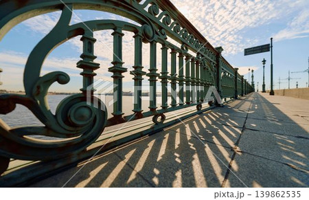 antique wrought iron railings of the Trinity Bridge, Troitsky Bridge on a spring morning antique wrought iron railings of the Trinity Bridge, Troitsky Bridge on a spring morning 139862535