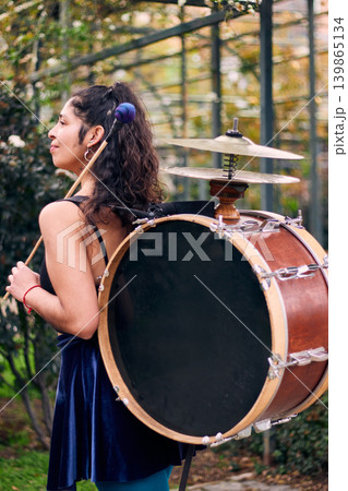 Detail of a musical instrument, bass drum and cymbals belonging to a chinchinera, a female street musician who dances and plays her drum in the streets. Chilean heritage, Chilean culture Detail of a musical instrument, bass drum and cymbals belonging to a chinchinera, a female street musician who dances and plays her drum in the streets. Chilean heritage, Chilean culture 139865134