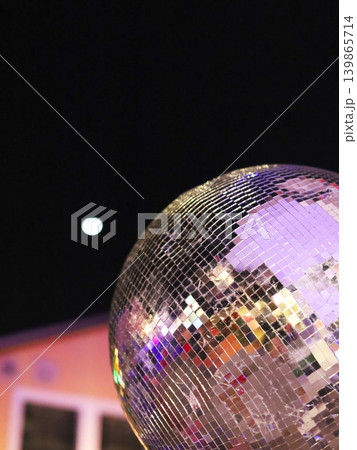 Shimmering Mirror Ball Under Night Lights Shimmering Mirror Ball Under Night Lights 139865714