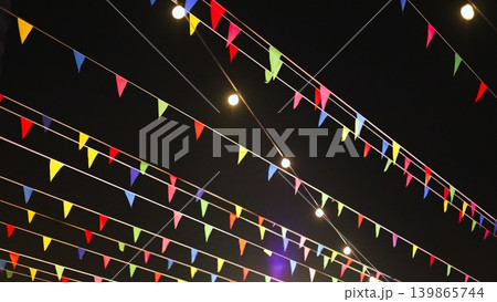Colorful Bunting and Lights Overhead at Night 139865744