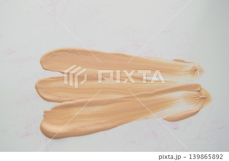 Liquid Foundation stain on white background. Surge of concealer highlighter 139865892