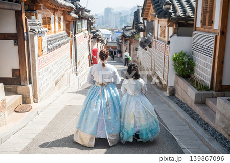 Korean mom and daughter in hanbok at Bukchon Hanok Village, Seoul Korean mom and daughter in hanbok at Bukchon Hanok Village, Seoul 139867096
