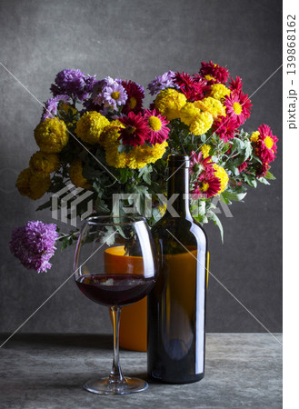 Still life with a bouquet of chrysanthemums and wine 139868162