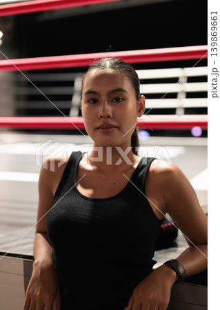 Vertical Portrait of Female Athlete in Boxing Ring Vertical Portrait of Female Athlete in Boxing Ring 139869661