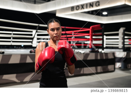 Horizontal Medium Shot of Female Boxer in Ring Horizontal Medium Shot of Female Boxer in Ring 139869815