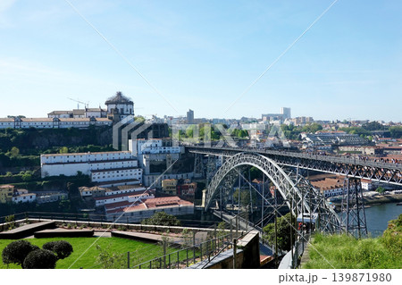 Iconic Dom Luis I Bridge and Douro River cityscape under blue sky in Porto Portugal Iconic Dom Luis I Bridge and Douro River cityscape under blue sky in Porto Portugal 139871980