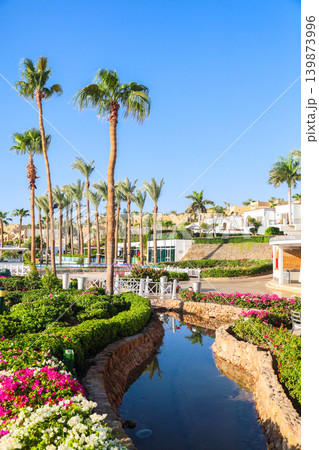A tropical hotel with a pond and garden on beautiful grounds 139873996