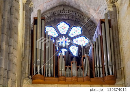 Pipe organ and stained glass rose window inside historic Porto Cathedral Portugal Pipe organ and stained glass rose window inside historic Porto Cathedral Portugal 139874013