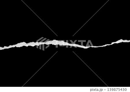 Ripped torn paper edges isolated on black background Ripped torn paper edges isolated on black background 139875430