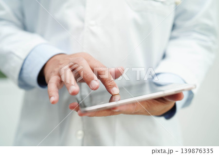 Doctor checking and note diagnosis medicine in clipboard of patients in hospital. 139876335