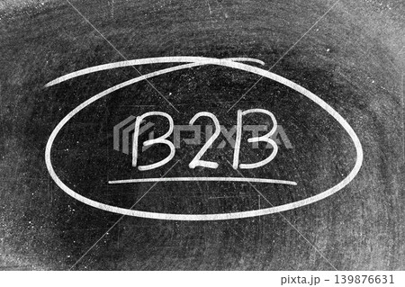 White chalk hand writing in word b2b (abbreviation of business to business) and circle shape on blackboard background White chalk hand writing in word b2b (abbreviation of business to business) and circle shape on blackboard background 139876631