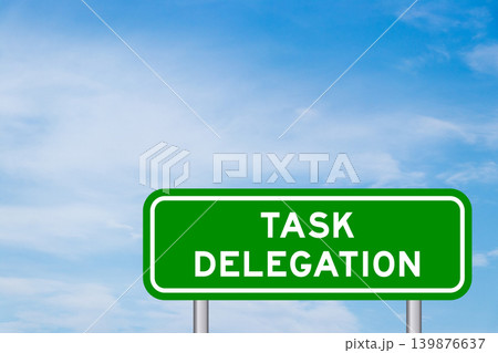 Green color transportation sign with word task delegation on blue sky with white cloud background Green color transportation sign with word task delegation on blue sky with white cloud background 139876637