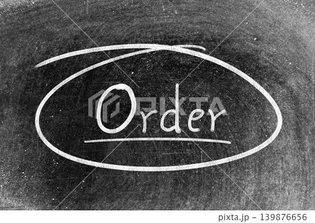 White chalk hand writing in word order and circle shape on blackboard background White chalk hand writing in word order and circle shape on blackboard background 139876656