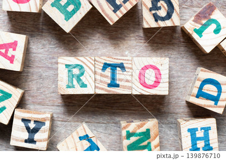 Alphabet letter block in word RTO (abbreviation of recovery time objective) and another letter on wood background Alphabet letter block in word RTO (abbreviation of recovery time objective) and another letter on wood background 139876710