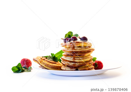 Sweet breakfast pancakes with fresh berries isolated on white 139878406